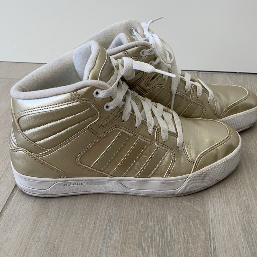 Used gold Adidas woman’s athletic sneakers shoes